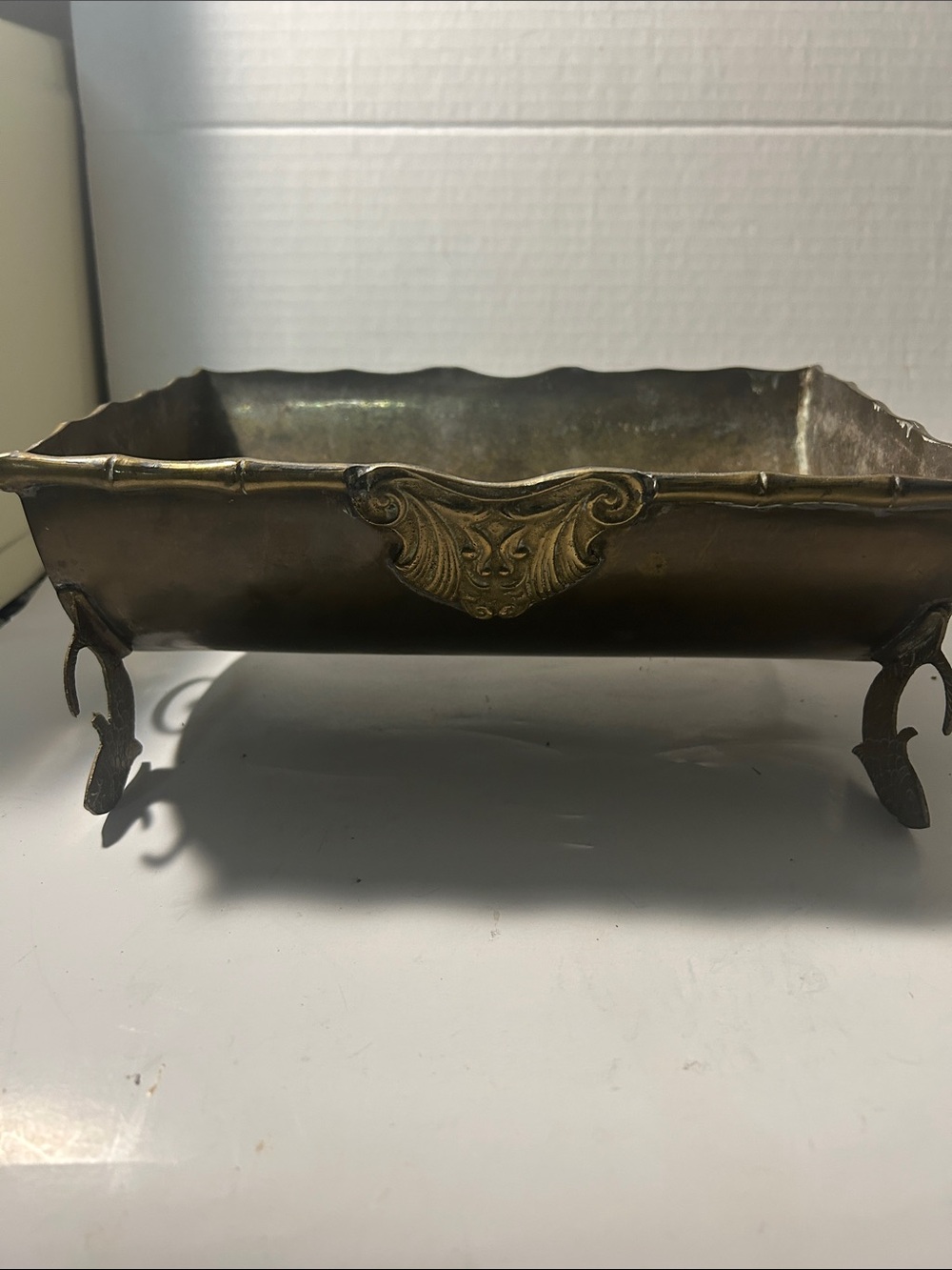 Planter metal with fish legs and lion heads on the side